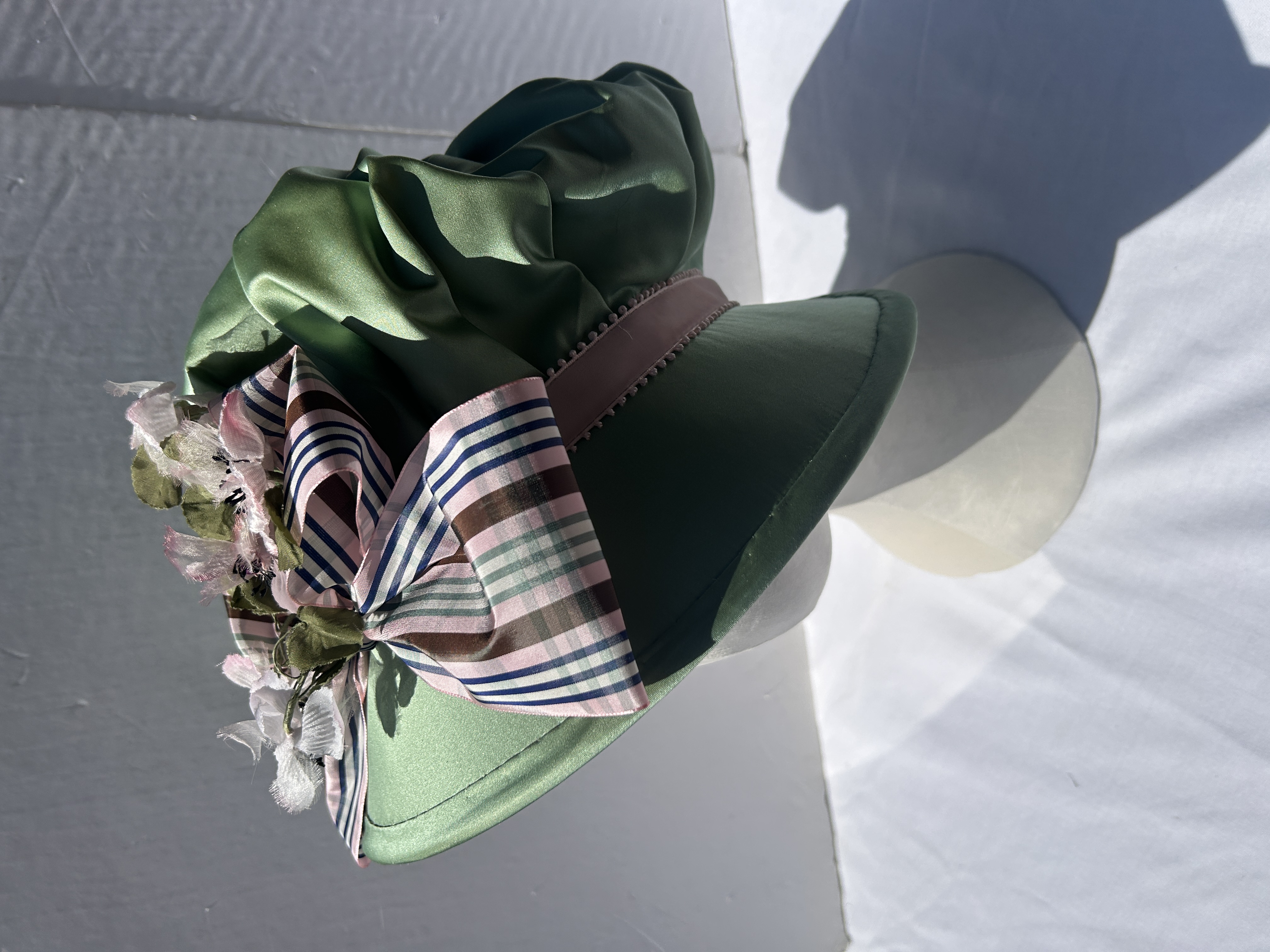 Side view green capote hat